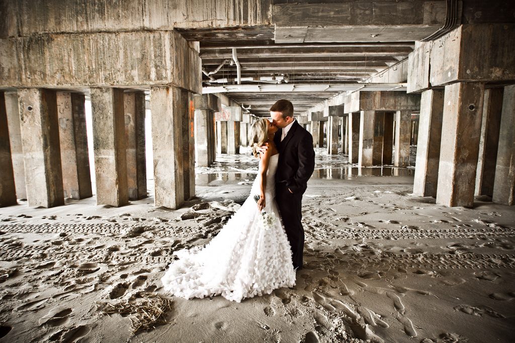 Couple under the Pier 1024x683 - Couples & Bridal Parties